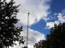 A tower worker finishes the installation of the new JK Antennas model JK402T at W1AW. [Michelle Patnode, W3MVP, photo]